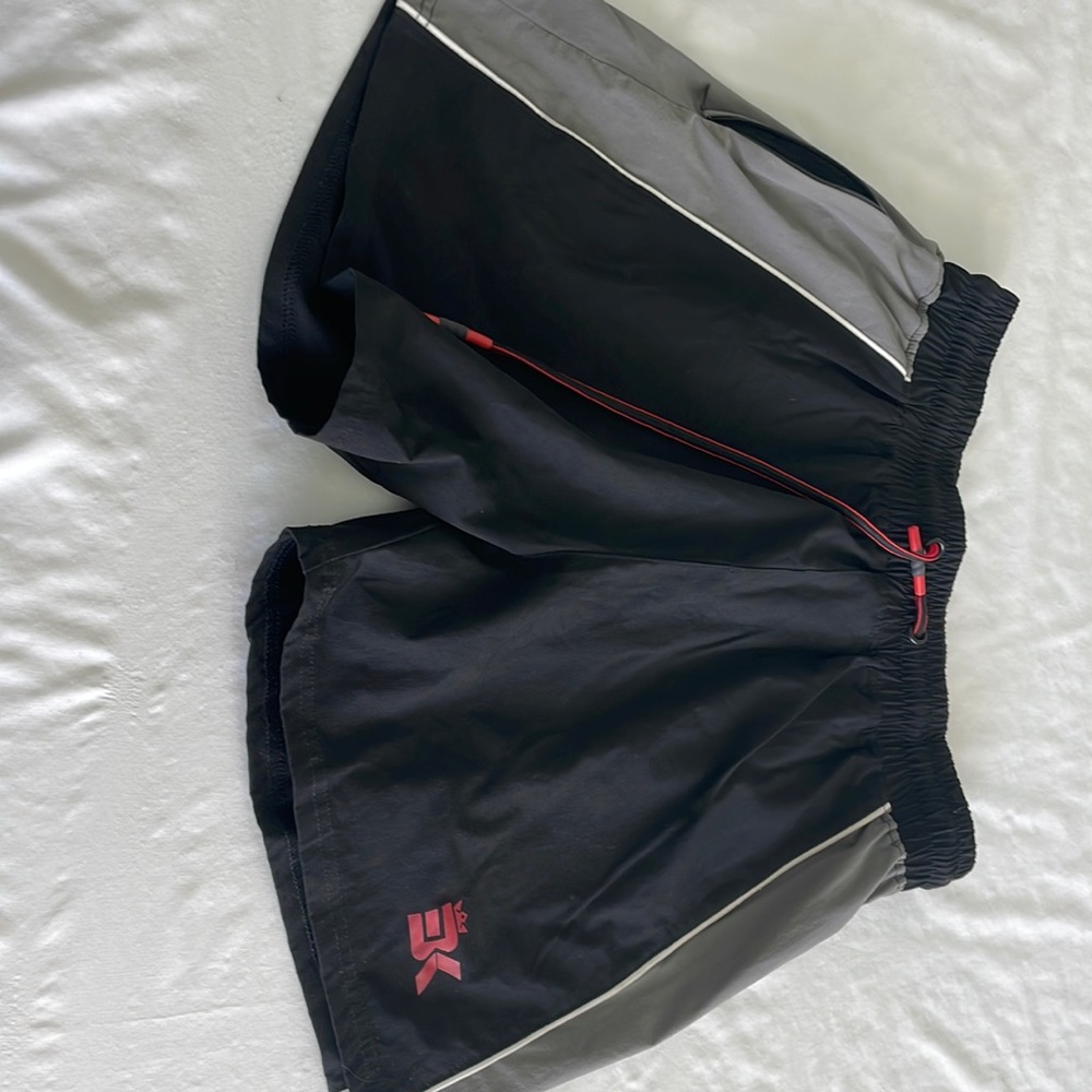 BK athletic interval LLC shorts. 100% polyester. Zippered side pocket no liner